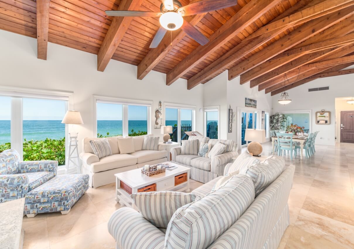 La Dolce Vita grand living room with ocean views and wood beam ceiling
